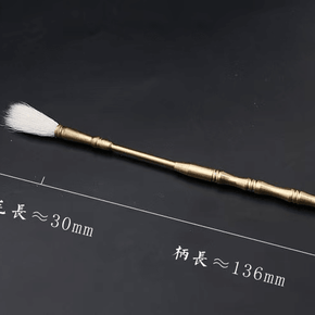 Detailed image of brass incense tool brush with cotton tip, showing dimensions of 136 mm handle and 30 mm bristle length on dark background