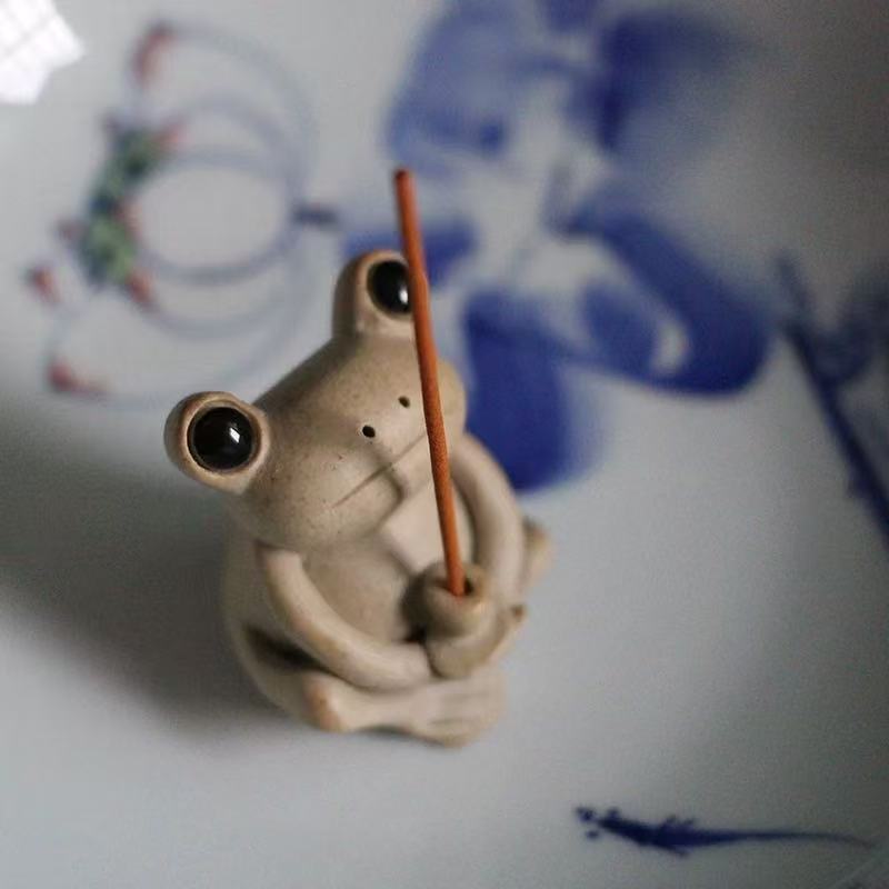 Ceramic frog incense holder closeup