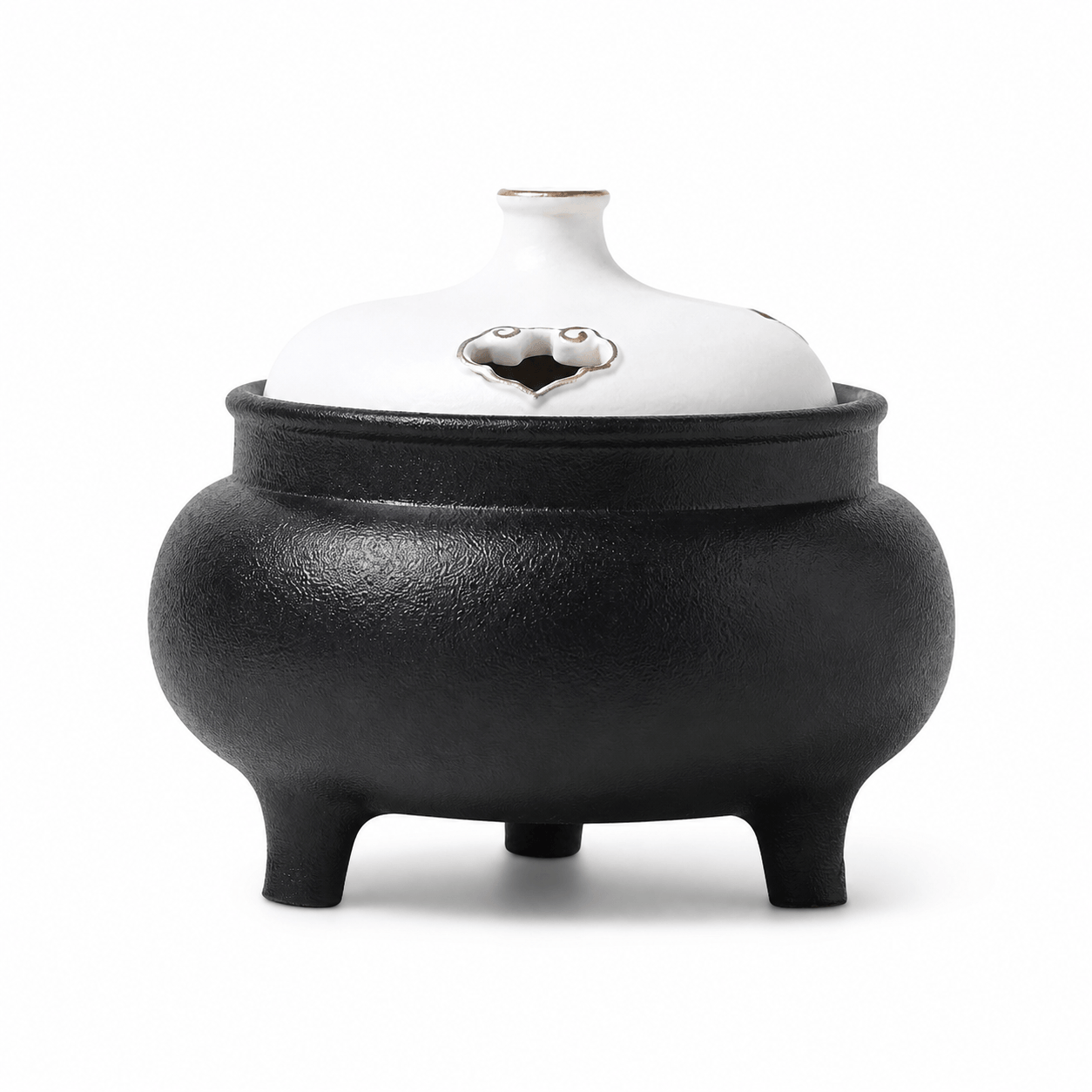 Classic black and white ceramic electric incense burner with a lidded three-leg design for flameless incense heating and home fragrance.