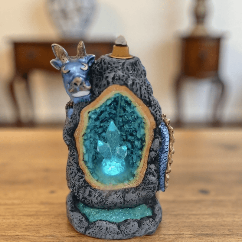 Battery-powered dragon backflow incense burner with LED-lit crystal cave, showing front design with incense cone on top.
