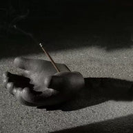 Hand incense holder shadow