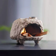 Front view of handmade ceramic incense burner with textured finish, burning palo santo stick inside with visible warm glow for meditation and purification rituals
