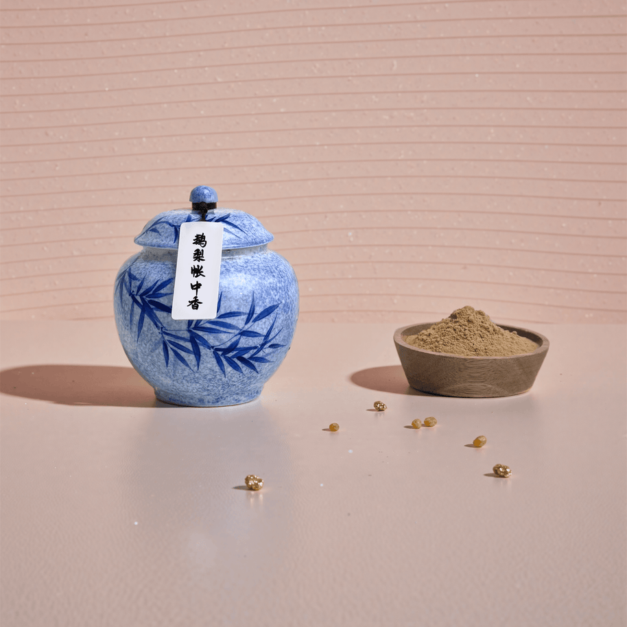 Midnight Pear handcrafted natural incense powder shown in a blue ceramic jar, with a small bowl displaying the fine powdered texture for aromatherapy and meditation.