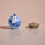 Midnight Pear handcrafted natural incense powder shown in a blue ceramic jar, with a small bowl displaying the fine powdered texture for aromatherapy and meditation.