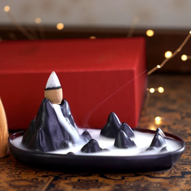 Backflow incense burner with natural agarwood cones, mountain-style ceramic design