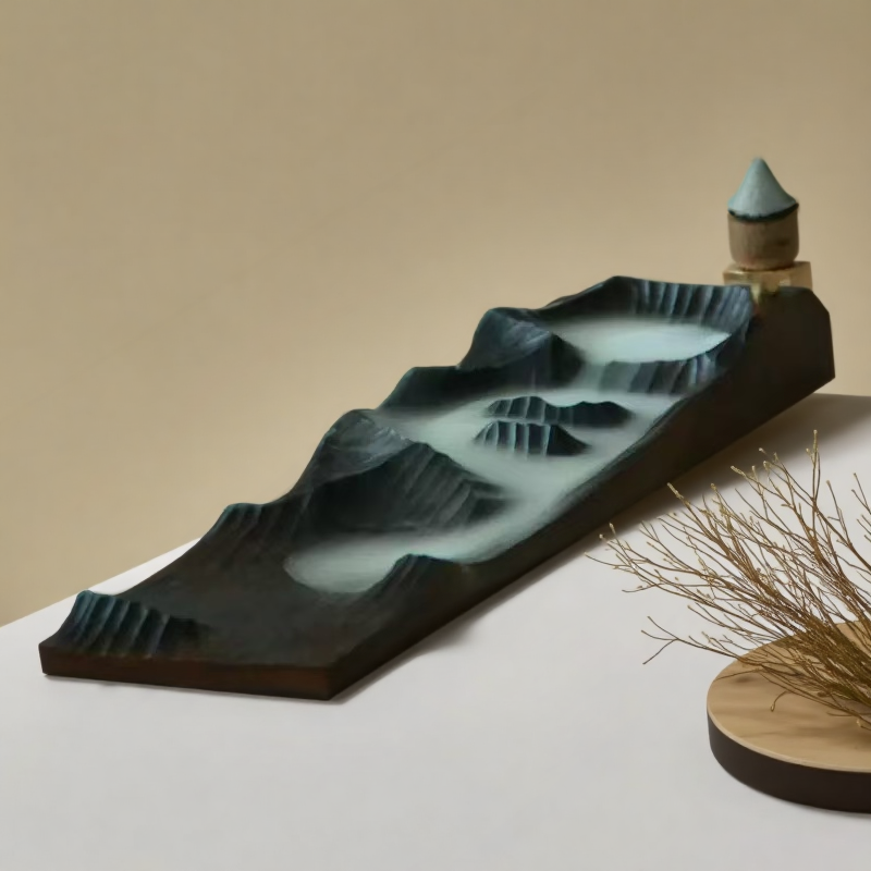 Close-up of Mountain Mist wooden incense holder with backflow cone on raised platform, sculpted to resemble layered peaks, styled on neutral background