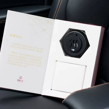 Portable electric car incense burner in gift box packaging, designed for aromatherapy heating with compact dashboard-friendly design
