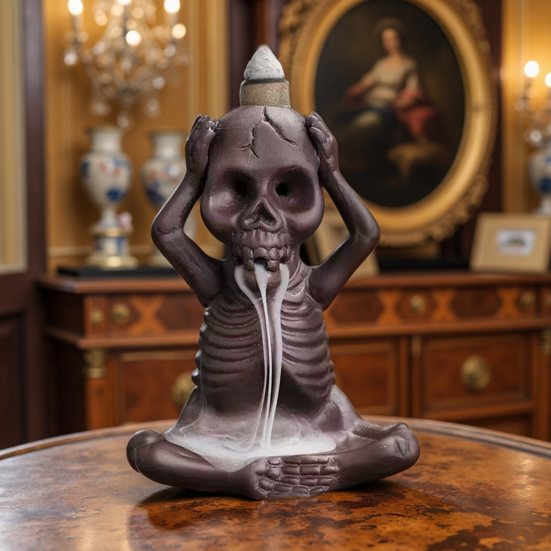 Single skeleton incense burner in "hear no evil" pose with backflow smoke flowing from the mouth.