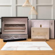 Transparent landscape incense burner gift set with acrylic holders and wood bases, shown in elegant packaging on tabletop