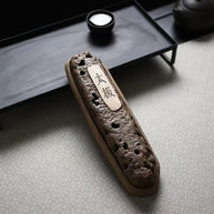 Top-down view of handmade volcanic ceramic incense holder with 