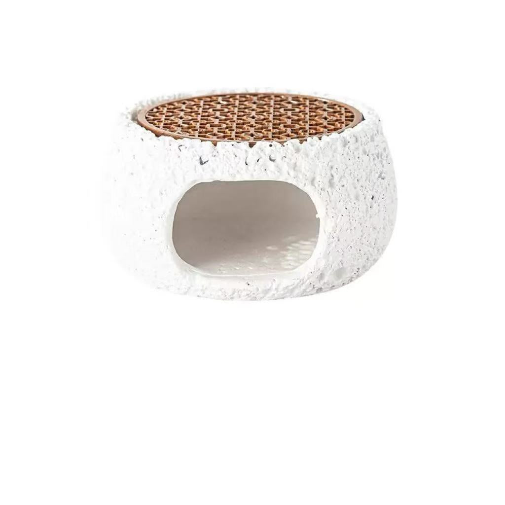 Front view of white cement incense burner featuring rough stone texture and rosewood grate, designed for burning palo santo, sage, or crystal incense for energy purification