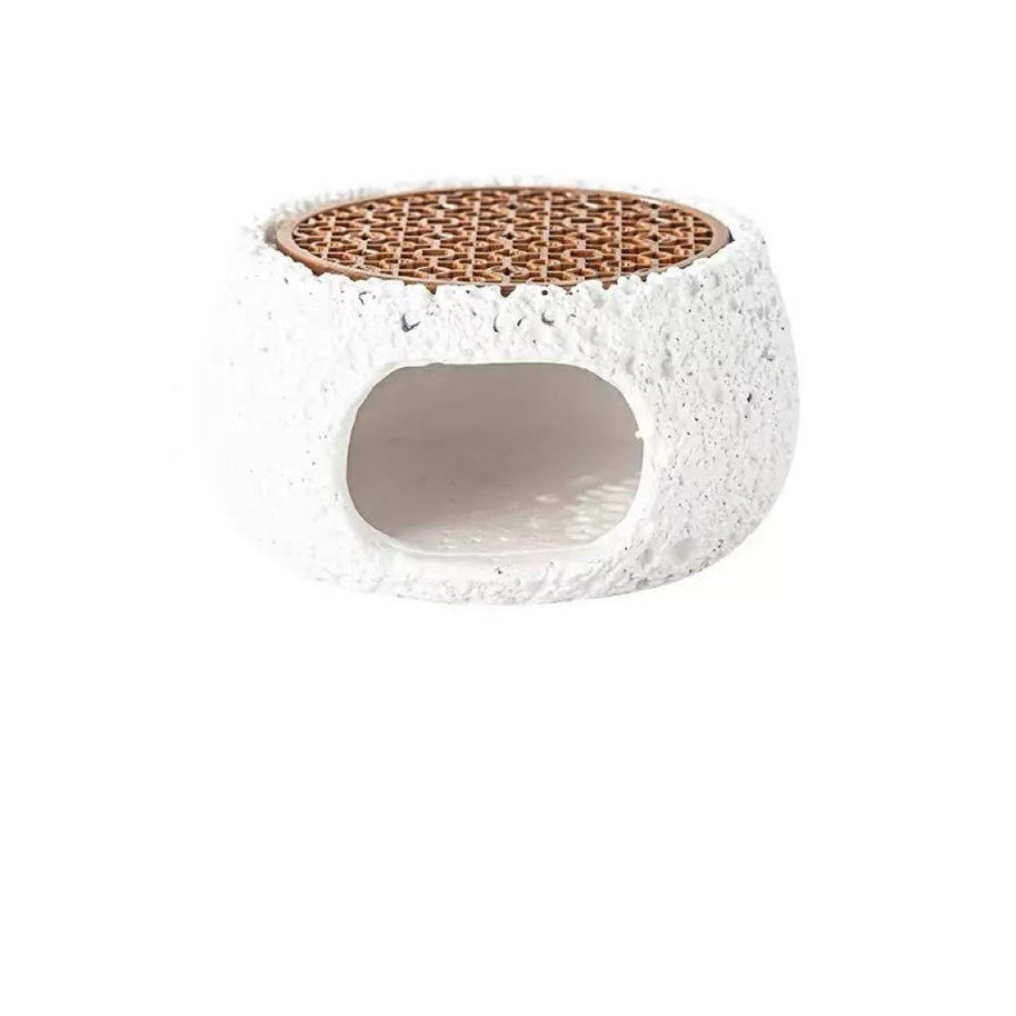 Front view of white cement incense burner featuring rough stone texture and rosewood grate, designed for burning palo santo, sage, or crystal incense for energy purification