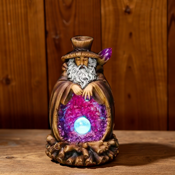 Wizard backflow incense burner with glowing crystal centerpiece, front view
