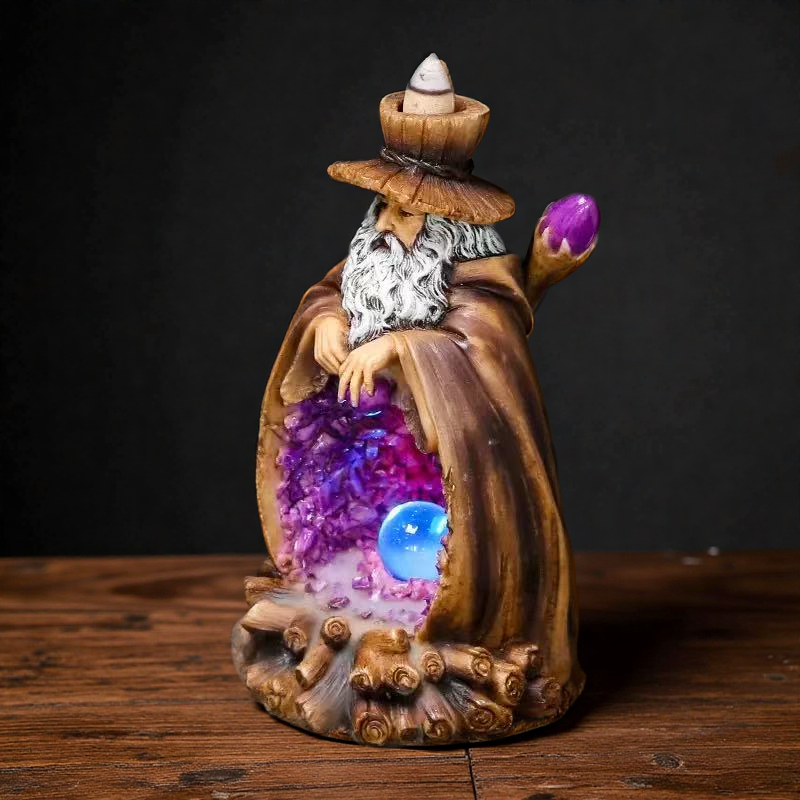 Side view of wizard backflow incense burner with crystal ball and glowing cave design